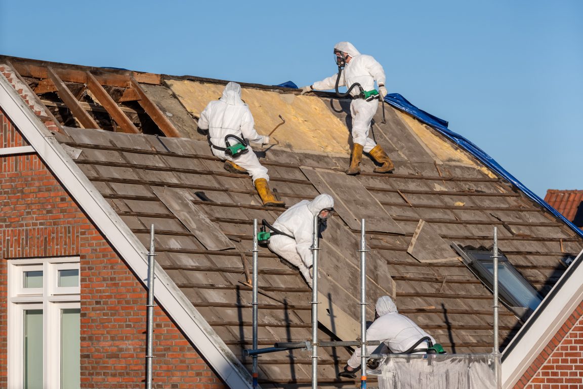 Asbestos removal team on roof