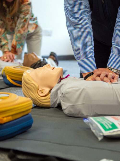 Two people conducting CPR training
