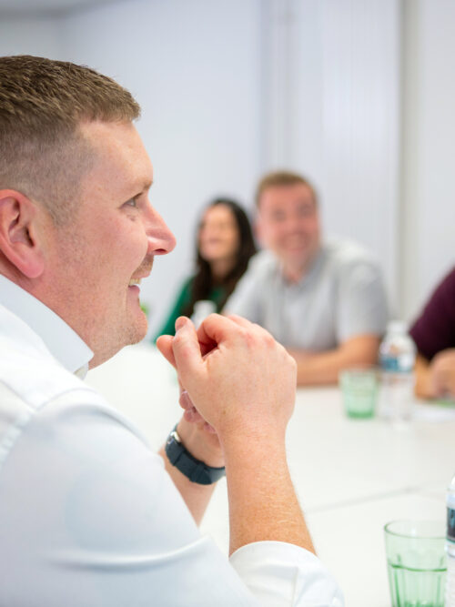 Group of happy employees in meeting room